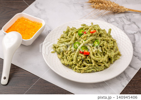 chinese traditional roasted green wheat noodles, handmade Nianzhuan with chili oil flavoring, healthy asian vegan food chinese traditional roasted green wheat noodles, handmade Nianzhuan with chili oil flavoring, healthy asian vegan food 140945406