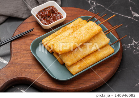 deep fried crispy rice cake skewers garnished with fresh mint leaf. deep fried crispy rice cake skewers garnished with fresh mint leaf. 140946092