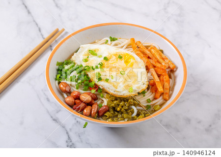 guilin Rice Noodles with Fried Egg and Peanuts, Traditional Chinese Street Food Bowl guilin Rice Noodles with Fried Egg and Peanuts, Traditional Chinese Street Food Bowl 140946124