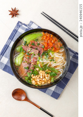 spicy Shaoyang Style Rice Noodles Soup with Beef Slices and Peanuts spicy Shaoyang Style Rice Noodles Soup with Beef Slices and Peanuts 140946155