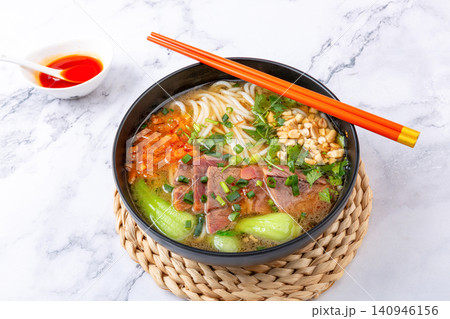 spicy Shaoyang Style Rice Noodles Soup with Beef Slices and Peanuts spicy Shaoyang Style Rice Noodles Soup with Beef Slices and Peanuts 140946156