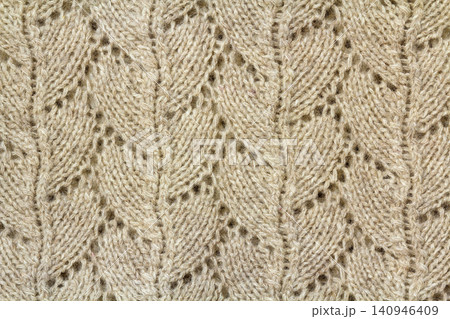 Background texture of beige pattern knitted fabric made of cotton or wool closeup Background texture of beige pattern knitted fabric made of cotton or wool closeup 140946409