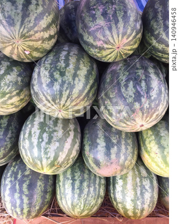 Watermelon fruit green striped pile market fresh summer harvest 140946458