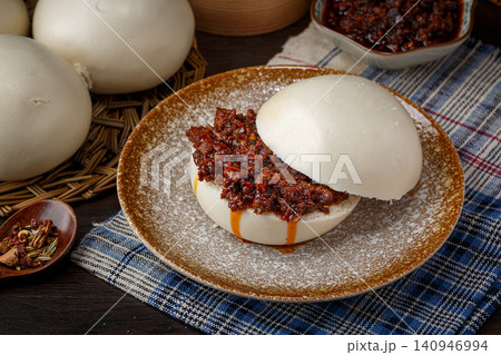 steamed Bun Sandwich with Beef and Spicy Chili Sauce, Chinese Traditional Food steamed Bun Sandwich with Beef and Spicy Chili Sauce, Chinese Traditional Food 140946994