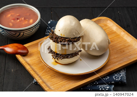 traditional Chinese Stick-Pressed Steamed Bun with Chili Sauce Dip, Rustic Street Food 140947024