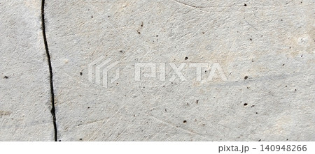 Light gray concrete surface texture with vertical cracks. Light gray concrete surface texture with vertical cracks. 140948266