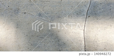 Weathered concrete wall texture with fine cracks and a natural light background. Weathered concrete wall texture with fine cracks and a natural light background. 140948272