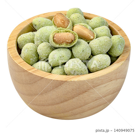 Wasabi coated peanuts in a wooden bowl isolated. Crunchy spicy green snack with roasted nut inside. Popular Japanese style appetizer and bar food. Professional studio shot. 140949075