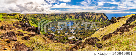 A beautiful panoramic view of the Rano Kau volcano crater lake under a blue sky on Easter Island, Chile A beautiful panoramic view of the Rano Kau volcano crater lake under a blue sky on Easter Island, Chile 140949991