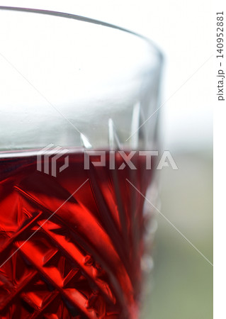 Close-up of a glass of red wine being filled or swirled. Close-up of a glass of red wine being filled or swirled. 140952881