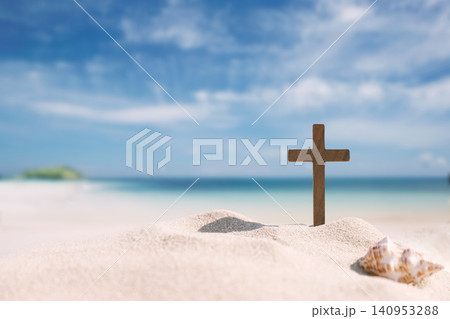 Seashells and the Cross of Jesus Christ on a sandy beach, background for church summer camps, summer Bible school, and summer retreats 140953288