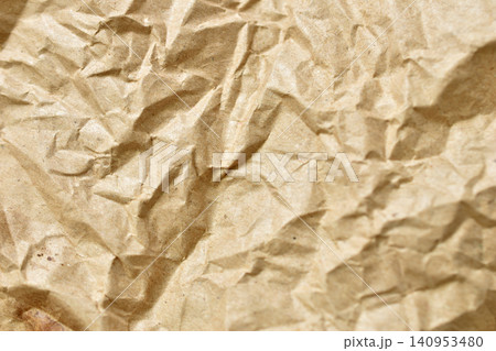 crumpled paper texture in neutral tones close-up background for natural design resources and copy space usage in web banners and posters with warm and cool tones. crumpled paper texture in neutral tones close-up background for natural design resources and copy space usage in web banners and posters with warm and cool tones. 140953480