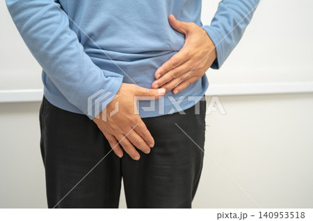 Hernia, Asian man stomach ache, abdominal pain and urology problem health. Hernia, Asian man stomach ache, abdominal pain and urology problem health. 140953518