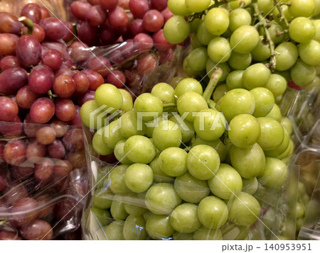 Fresh green and red grapes at market 140953951