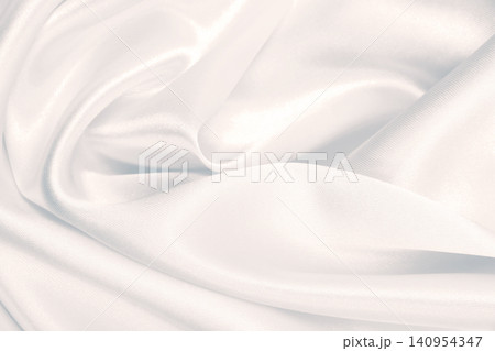 Smooth elegant grey silk or satin luxury cloth as wedding background. Luxurious background design Smooth elegant grey silk or satin luxury cloth as wedding background. Luxurious background design 140954347