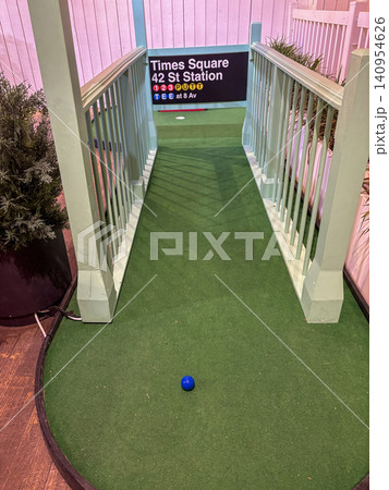 Indoor Mini Golf Setup With Times Square 42nd Street Station Sign Indoor Mini Golf Setup With Times Square 42nd Street Station Sign 140954626