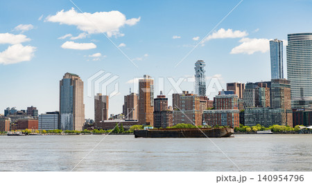 A view of the New York financial district fom Paulus Hook Pier in Jersey City, New Jersey.New York, United States. Manhattan New York NY NYC Skyline. Lower Manhattan and One World Trade Center in New A view of the New York financial district fom Paulus Hook Pier in Jersey City, New Jersey.New York, United States. Manhattan New York NY NYC Skyline. Lower Manhattan and One World Trade Center in New 140954796