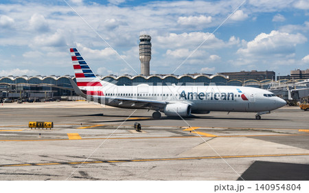 Washington DC, USA - June 04, 2024: American airline plane departure in airport. Airport terminal and runway strip. Aviation. Departure and arrival at airport. American aviation airline 140954804