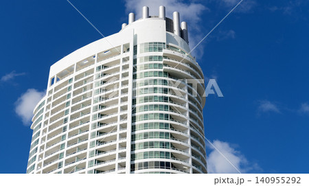 Apartment hotel building. Low angle view of building. Residential building architecture. Architectural exterior detail. Residential house modern exterior. Modern apartment building. Copy space Apartment hotel building. Low angle view of building. Residential building architecture. Architectural exterior detail. Residential house modern exterior. Modern apartment building. Copy space 140955292