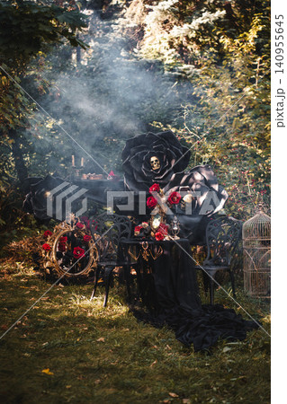 Haunted Garden Scene with Oversized Black Flowers and Red Roses Haunted Garden Scene with Oversized Black Flowers and Red Roses 140955645