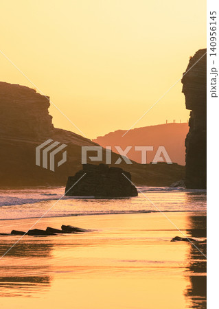 Rocky sea coast at sunrise. Playa de Las Catedrales, Ribadeo, Spain, Europe Rocky sea coast at sunrise. Playa de Las Catedrales, Ribadeo, Spain, Europe 140956145