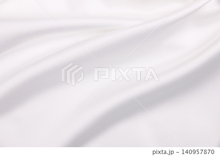 Smooth elegant white silk or satin luxury cloth texture as wedding background. Luxurious background design 140957870