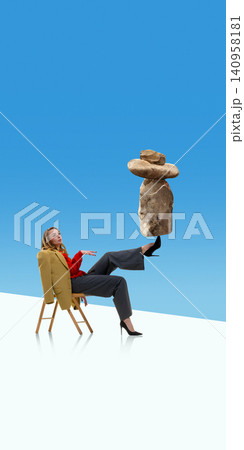 Woman balancing heavy rocks on foot while sitting on chair. Woman balancing heavy rocks on foot while sitting on chair. 140958181