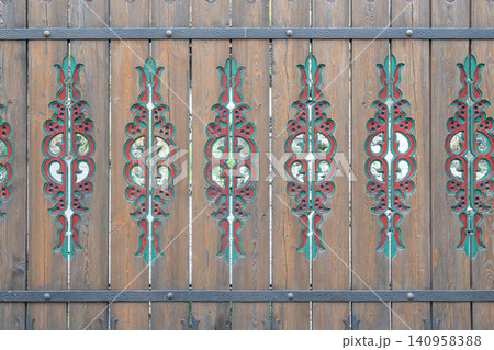 Wooden fence with colorful patterns in a village Wooden fence with colorful patterns in a village 140958388