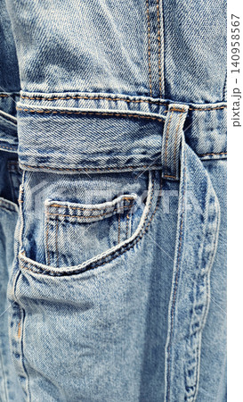 Close-up of blue denim jeans texture background Close-up of blue denim jeans texture background 140958567