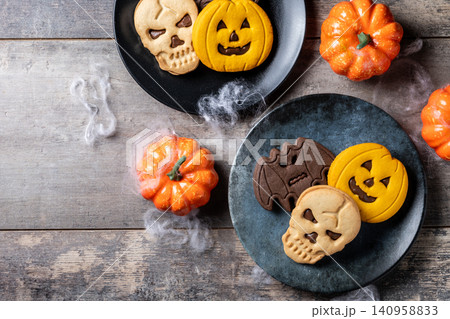 Halloween sandwich cookies on wooden table Halloween sandwich cookies on wooden table 140958833