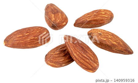 Group of whole roasted almonds isolated. High quality macro shot of organic nuts. Perfect for healthy snack, nutrition, and food related designs. Clean natural texture. Group of whole roasted almonds isolated. High quality macro shot of organic nuts. Perfect for healthy snack, nutrition, and food related designs. Clean natural texture. 140959316