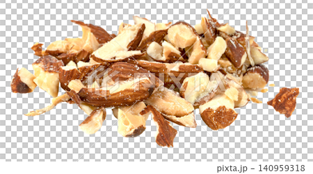 Close-up of a pile of chopped and crushed almond pieces isolated. High-quality healthy food ingredient for baking, salads, and snacks. Organic crunchy roasted nut fragments. 140959318