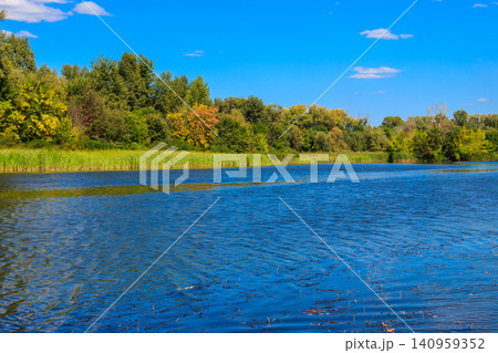 Summer landscape with beautiful river, green trees and blue sky Summer landscape with beautiful river, green trees and blue sky 140959352
