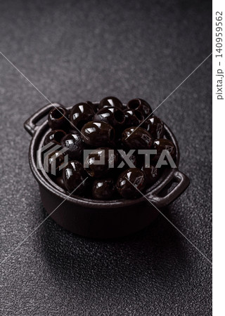 Black canned olives without pits for salads and snacks. Black olives without pits 140959562