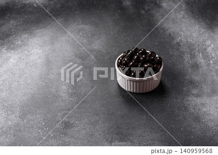 Black canned olives without pits for salads and snacks. Black olives without pits 140959568