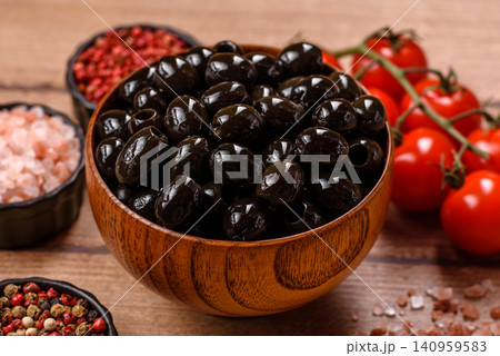 Black canned olives without pits for salads and snacks. Black olives without pits 140959583