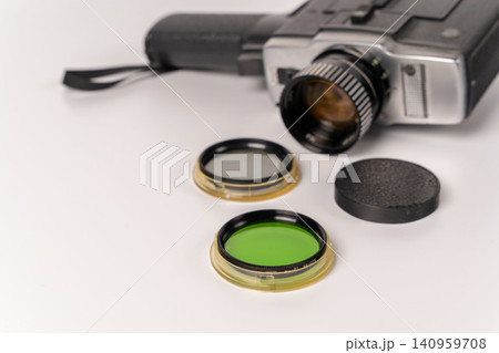Vintage movie camera with light filters on a simple background 140959708