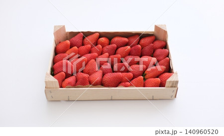 strawberries in a wooden box fresh strawberries in wooden boxes on fields background 140960520
