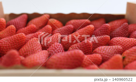 strawberries in a wooden box fresh strawberries in wooden boxes on fields background strawberries in a wooden box fresh strawberries in wooden boxes on fields background 140960522