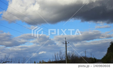 power transmission towers over field dramatic clouds sky energy infrastructure landscape power transmission towers over field dramatic clouds sky energy infrastructure landscape 140960608