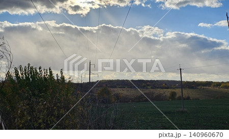 power transmission towers over field dramatic clouds sky energy infrastructure landscape power transmission towers over field dramatic clouds sky energy infrastructure landscape 140960670