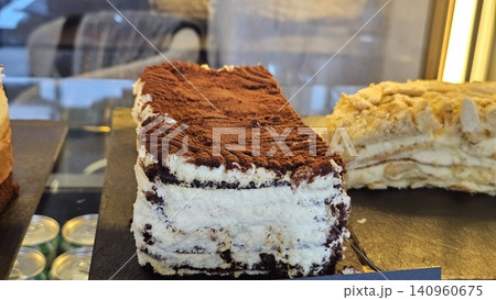 Italian Tiramisu with Cocoa Powder and Mascarpone Cream Served in Glass Cup for Premium Dessert Object and Luxury Food Concept 140960675
