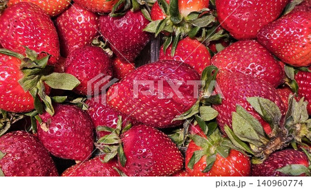 Fresh ripe strawberries displayed in plastic containers at market 140960774