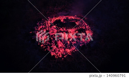 Close-up of glowing fire embers and burning charcoal creating intense heat and dramatic red light, ideal for concepts of warmth, energy, danger, survival, and raw elemental fire. Close-up of glowing fire embers and burning charcoal creating intense heat and dramatic red light, ideal for concepts of warmth, energy, danger, survival, and raw elemental fire. 140960791