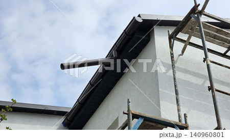 Construction and repair of the rural house with balcony, eaves, windows, chimney, roofing, fixing facade, insulation, plastering and using color. House construction.  140960801