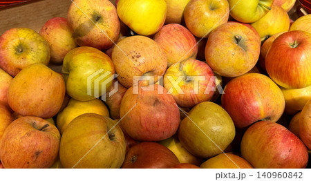 Red yellow apples fresh apples stacked together, showcasing their natural texture and vibrant colors. Perfect for food backgrounds, healthy eating concepts, and organic produce themes. Red yellow apples fresh apples stacked together, showcasing their natural texture and vibrant colors. Perfect for food backgrounds, healthy eating concepts, and organic produce themes. 140960842