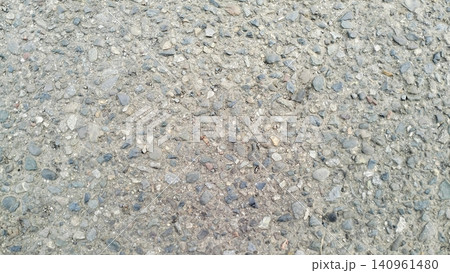 Asphalt Road Texture with Rough Gravel Stones Background Asphalt Road Texture with Rough Gravel Stones Background 140961480