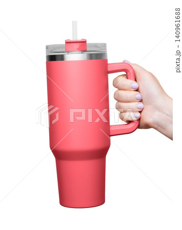 Female Hand Holding 40 oz red tumbler. Tumbler With Handle, Travel Mug Straw Covers Cup with Lid Female Hand Holding 40 oz red tumbler. Tumbler With Handle, Travel Mug Straw Covers Cup with Lid 140961688
