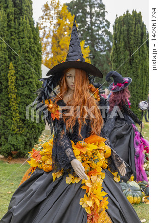 Halloween witch mannequin displaying autumn fall decoration in Prague Halloween witch mannequin displaying autumn fall decoration in Prague 140961794