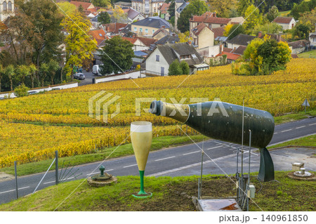 Giant champagne bottle pouring into glass in Avize, France 140961850
